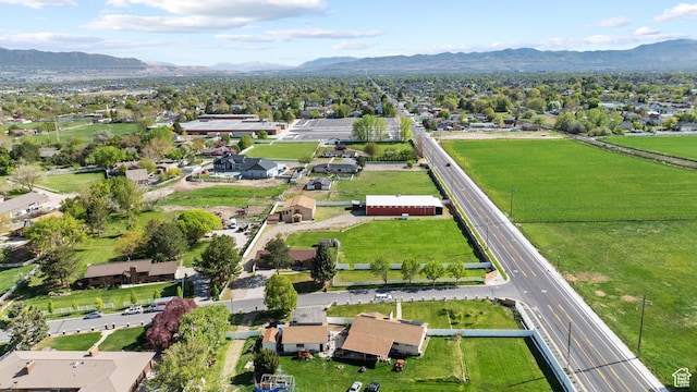 drone / aerial view featuring a residential view and a mountain view