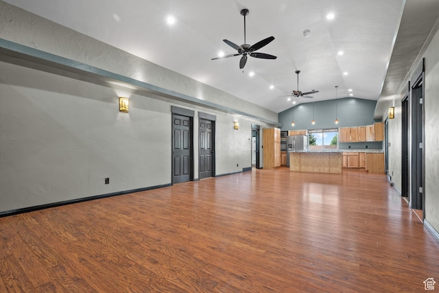 unfurnished living room with recessed lighting, wood finished floors, ceiling fan, and lofted ceiling