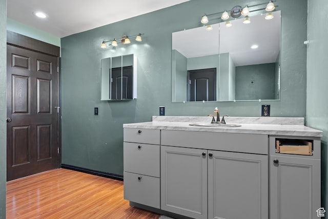 bathroom featuring vanity and wood finished floors