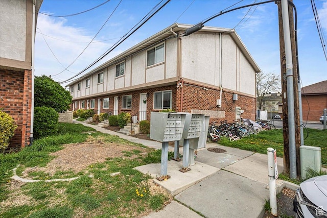 556 W 800 N Unit 15, Provo, UT 84601 - exterior space featuring brick siding, stucco siding, and mail area