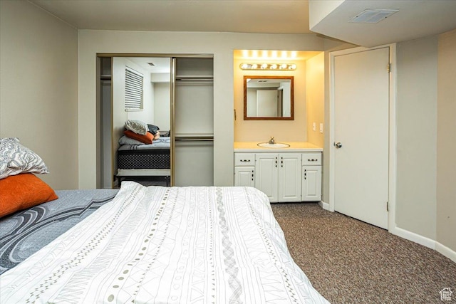 556 W 800 N Unit 15, Provo, UT 84601 - bedroom featuring a sink, a closet, visible vents, dark carpet, and baseboards