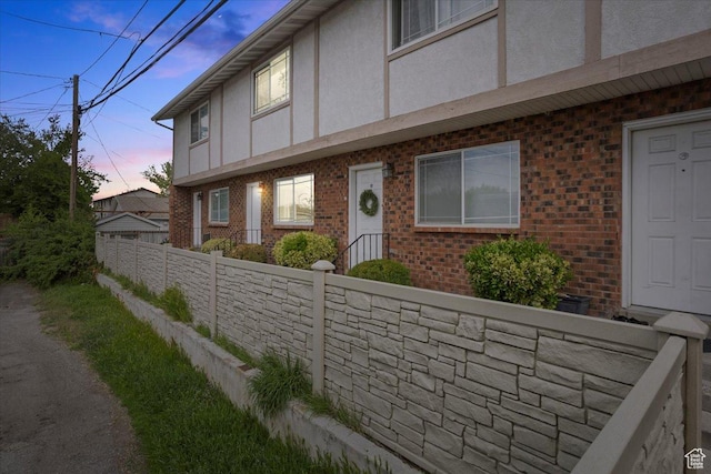 556 W 800 N Unit 15, Provo, UT 84601 - view of front of house with fence, stucco siding, and brick siding