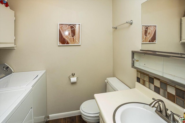 556 W 800 N Unit 15, Provo, UT 84601 - half bathroom with independent washer and dryer, vanity, toilet, baseboards, and wood finished floors
