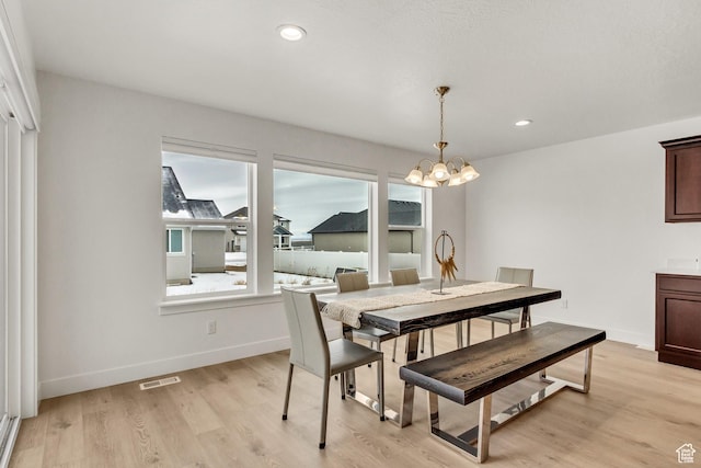 188 E Bruin Dr, Eagle Mountain, UT 84005 - dining room with a chandelier, light wood-style flooring, and recessed lighting
