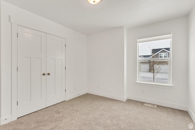 188 E Bruin Dr, Eagle Mountain, UT 84005 - unfurnished bedroom with light carpet and a closet