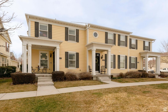 4947 W Calton Ln, South Jordan, UT 84009 - view of front facade featuring covered porch and a front yard
