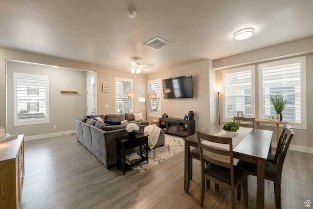 4947 W Calton Ln, South Jordan, UT 84009 - dining space featuring baseboards, visible vents, wood finished floors, and ceiling fan