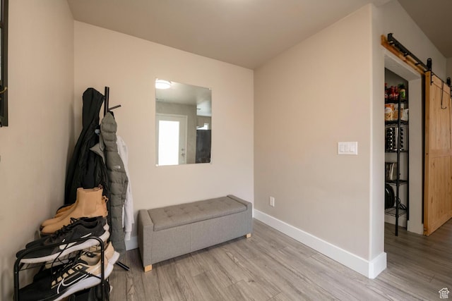 4947 W Calton Ln, South Jordan, UT 84009 - living area with wood finished floors, baseboards, and a barn door