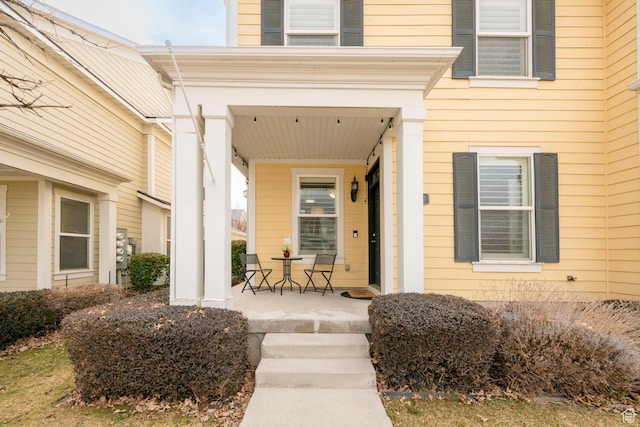doorway to property featuring covered porch