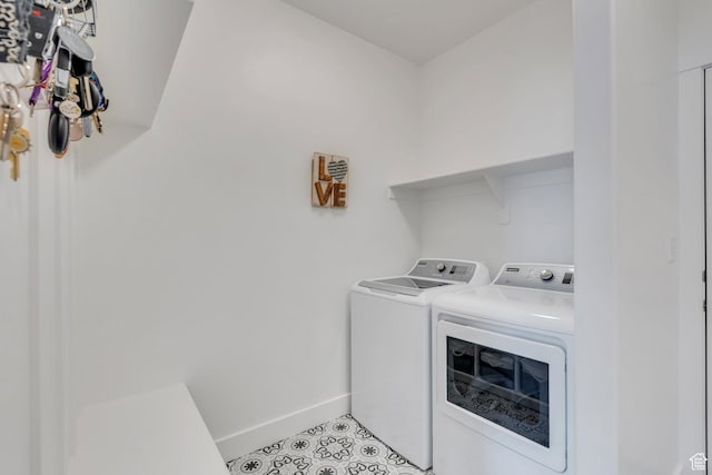 3498 N Delta St, Eagle Mountain, UT 84005 - laundry room featuring washer and dryer, baseboards, and light tile patterned flooring