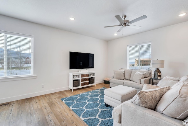 3498 N Delta St, Eagle Mountain, UT 84005 - living room featuring plenty of natural light, baseboards, a ceiling fan, light wood-style floors, and recessed lighting