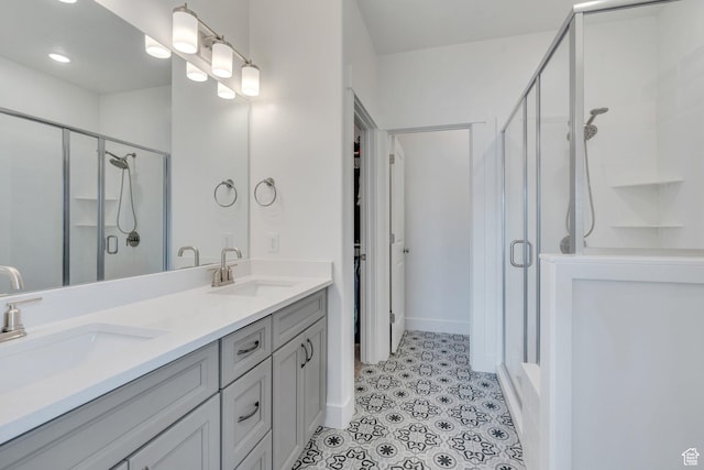 3498 N Delta St, Eagle Mountain, UT 84005 - bathroom featuring a shower stall, double vanity, and tile patterned floors