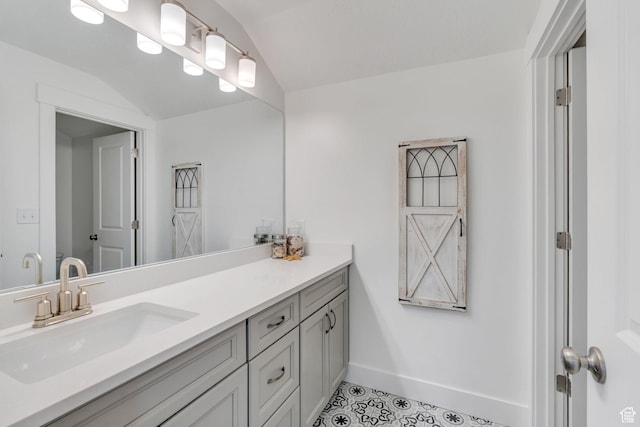 3498 N Delta St, Eagle Mountain, UT 84005 - bathroom featuring vanity, tile patterned flooring, baseboards, and lofted ceiling