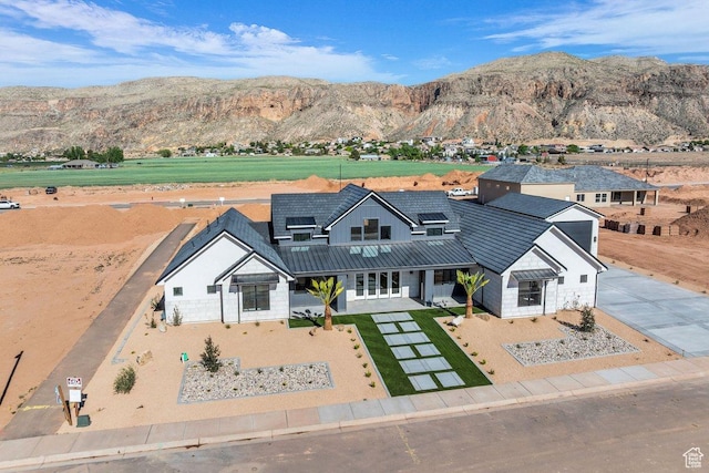 1907 S 950 W, Hurricane, UT 84737 - view of front of property with french doors, roof mounted solar panels, and a mountain view