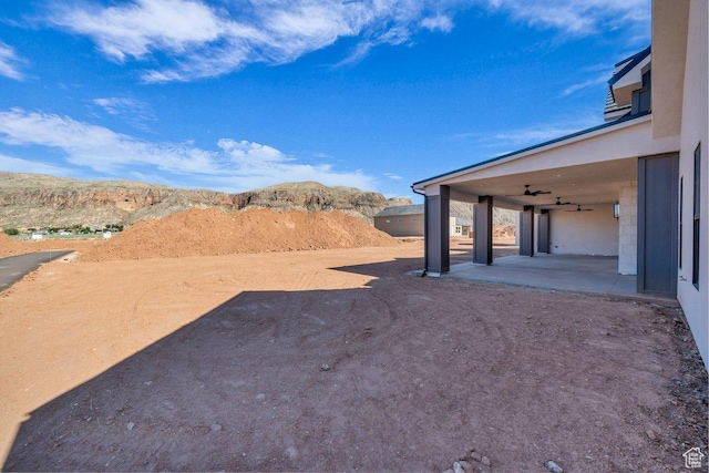 1907 S 950 W, Hurricane, UT 84737 - view of yard with a mountain view, ceiling fan, and a patio area