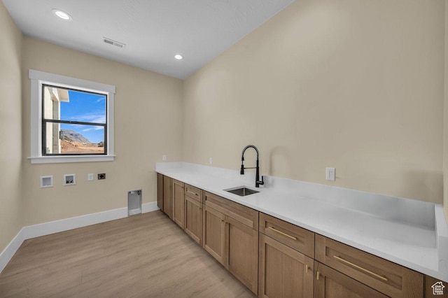 1907 S 950 W, Hurricane, UT 84737 - laundry area featuring a sink, washer hookup, electric dryer hookup, visible vents, and light wood-style flooring