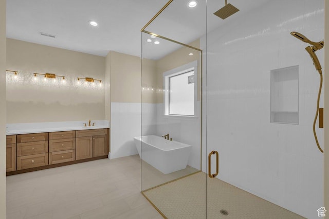 1907 S 950 W, Hurricane, UT 84737 - bathroom with recessed lighting, a freestanding bath, a shower stall, a sink, and visible vents