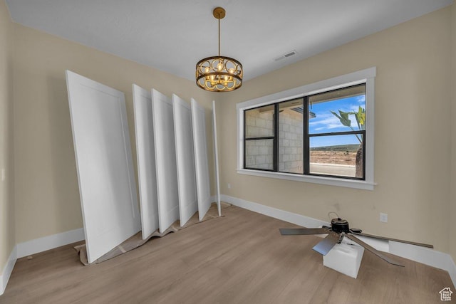 1907 S 950 W, Hurricane, UT 84737 - unfurnished room with baseboards, visible vents, a notable chandelier, and light wood finished floors