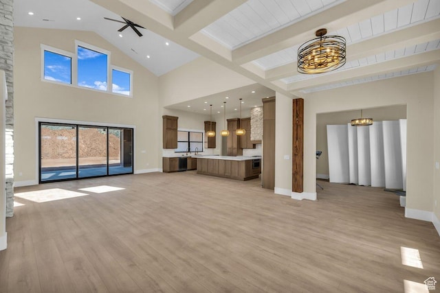 1907 S 950 W, Hurricane, UT 84737 - unfurnished living room featuring beamed ceiling, a notable chandelier, light wood-style floors, baseboards, and high vaulted ceiling