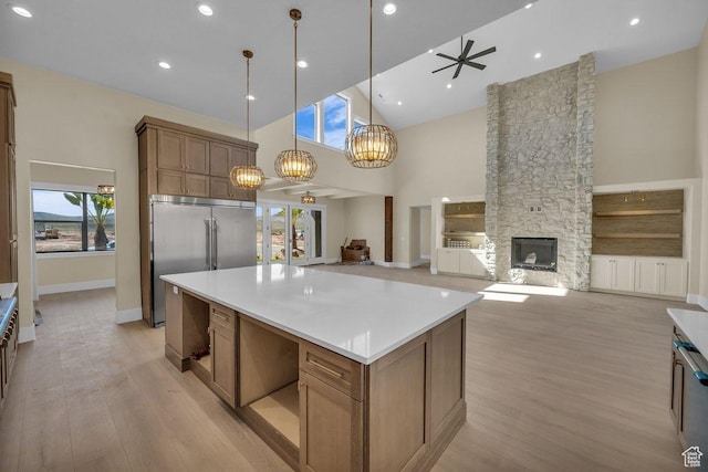 1907 S 950 W, Hurricane, UT 84737 - kitchen with a kitchen island, built in fridge, ceiling fan with notable chandelier, light wood finished floors, and high vaulted ceiling