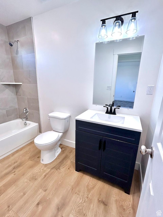 991 N 2500 W, Vernal, UT 84078 - bathroom featuring wood finished floors, toilet, tub / shower combination, and vanity