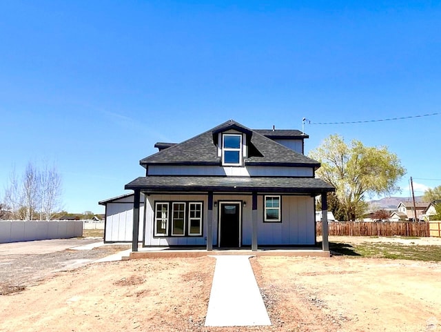 991 N 2500 W, Vernal, UT 84078 - view of front of home featuring a shingled roof, covered porch, and fence