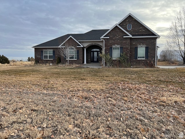 view of front of house featuring brick siding