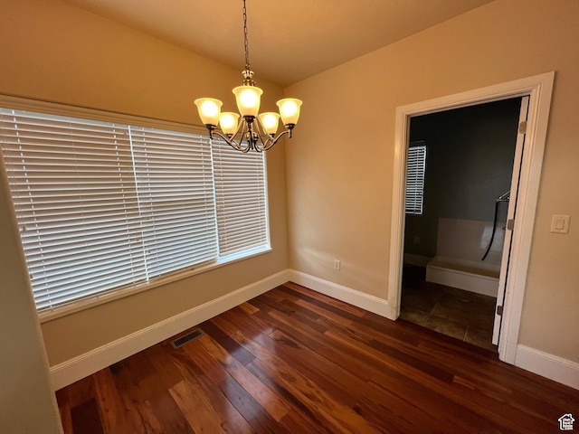 5867 W 4000 N, Roosevelt, UT 84066 - unfurnished dining area featuring visible vents, a notable chandelier, dark wood-style floors, and baseboards