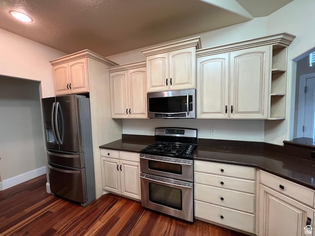 5867 W 4000 N, Roosevelt, UT 84066 - kitchen featuring appliances with stainless steel finishes, dark countertops, baseboards, recessed lighting, and dark wood finished floors