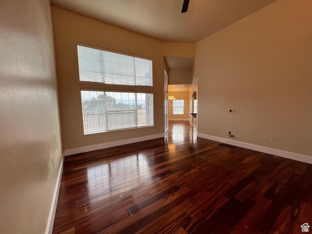 5867 W 4000 N, Roosevelt, UT 84066 - unfurnished room with wood finished floors, baseboards, visible vents, and ceiling fan with notable chandelier