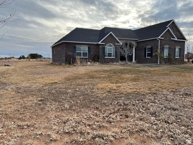 5867 W 4000 N, Roosevelt, UT 84066 - view of front facade featuring brick siding and a shingled roof