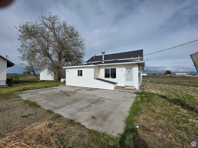 98 W 1000 N, Delta, UT 84624 - back of house with a patio area and a lawn