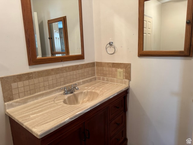 bathroom featuring tasteful backsplash and vanity