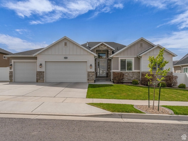 13952 S Indian Ln E, Herriman, UT 84096 - craftsman inspired home with board and batten siding, stone siding, an attached garage, and driveway