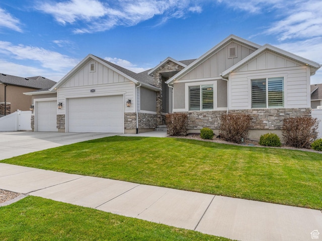 craftsman inspired home featuring a front lawn, board and batten siding, an attached garage, and stone siding
