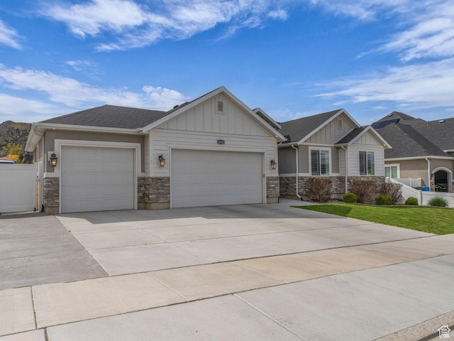 13952 S Indian Ln E, Herriman, UT 84096 - craftsman inspired home with board and batten siding, a garage, stone siding, driveway, and fence