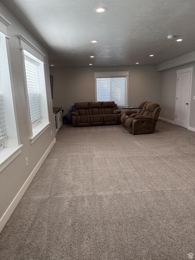 13952 S Indian Ln E, Herriman, UT 84096 - living area featuring carpet floors, baseboards, and recessed lighting