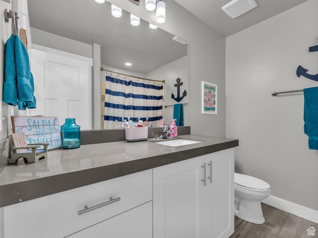 13952 S Indian Ln E, Herriman, UT 84096 - full bath with wood finished floors, toilet, vanity, baseboards, and a shower with curtain