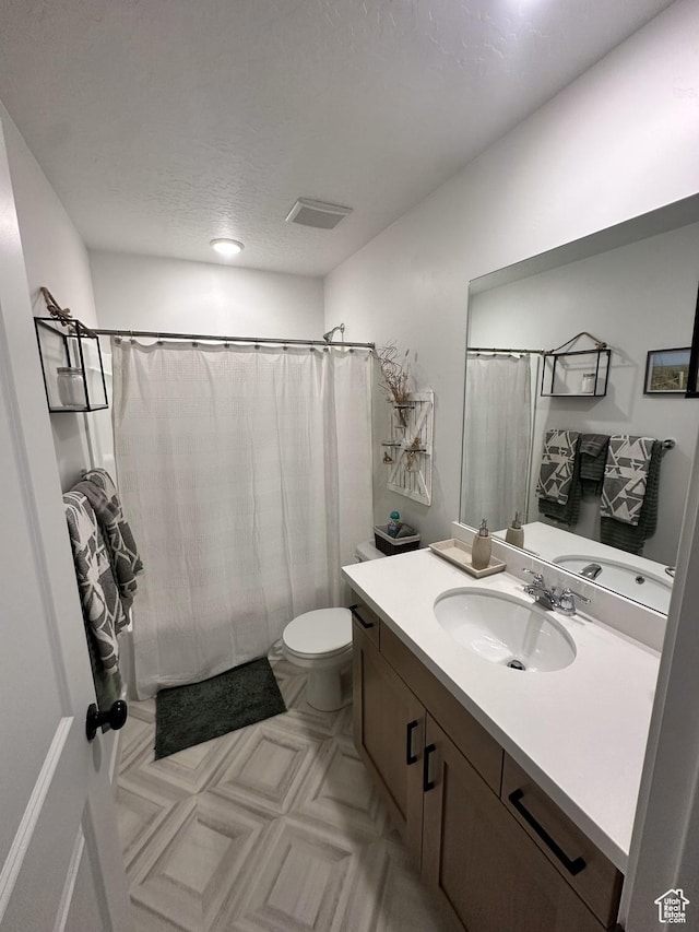 12975 S Spook Gulch Ct Unit 621, Riverton, UT 84096 - full bathroom with vanity, curtained shower, visible vents, and toilet