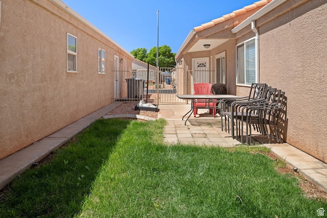 2369 S 780 W, Hurricane, UT 84737 - view of yard featuring fence, a patio area, and central air condition unit