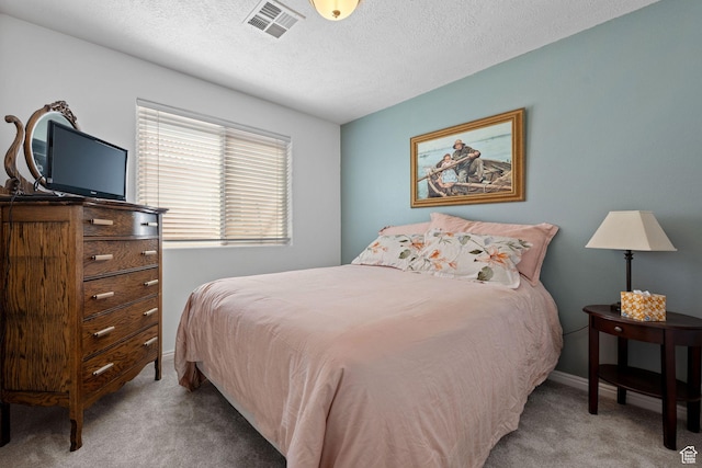 2369 S 780 W, Hurricane, UT 84737 - bedroom with a textured ceiling, visible vents, carpet flooring, and baseboards