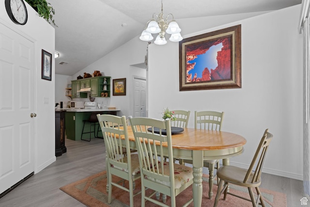 2369 S 780 W, Hurricane, UT 84737 - dining area featuring lofted ceiling, a chandelier, light wood-style flooring, and baseboards