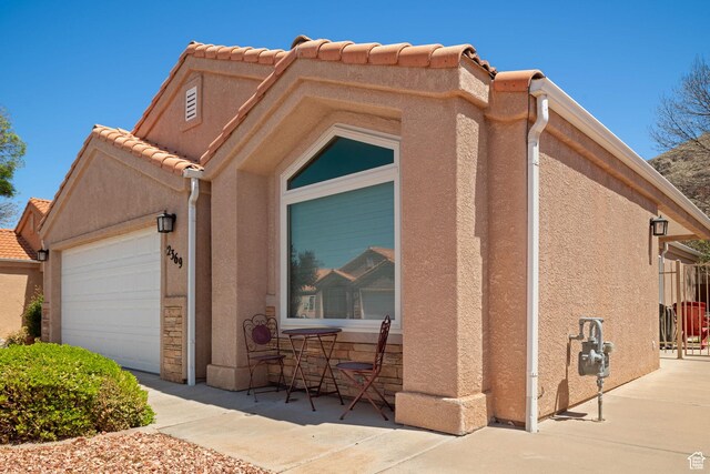 2369 S 780 W, Hurricane, UT 84737 - view of home's exterior with a garage and stucco siding