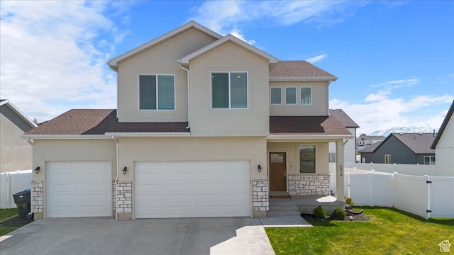 574 W 500 N, Smithfield, UT 84335 - view of front of home featuring stone siding, stucco siding, and fence