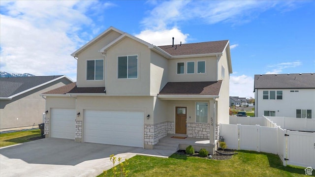 574 W 500 N, Smithfield, UT 84335 - view of front of home featuring a garage, stone siding, concrete driveway, stucco siding, and fence