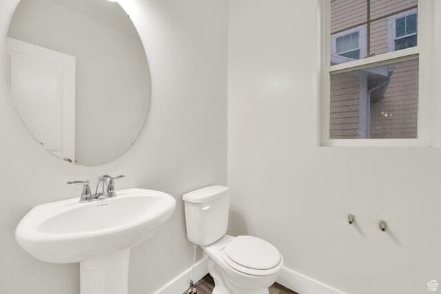5103 W S Jordan Pkwy, South Jordan, UT 84009 - bathroom featuring a sink, toilet, and baseboards