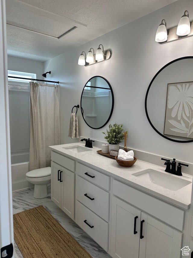 5409 N Orville St Unit 414, Eagle Mountain, UT 84005 - full bath featuring marble finish floor, a textured ceiling, double vanity, and a sink