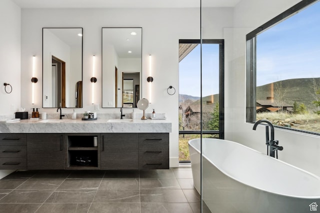 4014 Aspen Camp Loop, Park City, UT 84098 - full bathroom with double vanity, a healthy amount of sunlight, a freestanding bath, and a sink