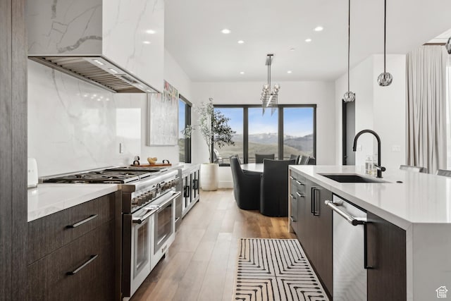 4014 Aspen Camp Loop, Park City, UT 84098 - kitchen featuring recessed lighting, a sink, modern cabinets, stainless steel appliances, and wall chimney exhaust hood