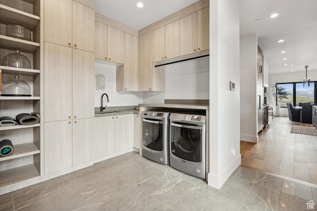 4014 Aspen Camp Loop, Park City, UT 84098 - washroom featuring cabinet space, marble finish floor, a sink, baseboards, and washer and clothes dryer